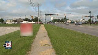 Man who wrote threatening note over political signs faces a reduced charge