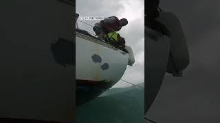 U.S. Coast Guard rescues man and dog from sinking boat off Florida coast