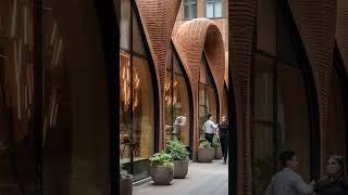 The #architecture displayed utilizes #brick to create fluid, #organicforms