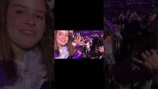 Olivia Rodrigo shows her reaction to a fan's gift during her concert 