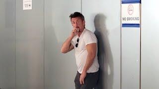 Sean Penn Enjoys A Cigarette In Front Of No Smoking Sign Upon Returning From Ukraine