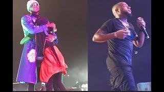 The Crowd goes wild as Kizz Daniel Hugs a Lady from the crowd at Davido's show