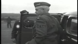 US General Omar Bradley deplanes and greeted by US Major General Floyd Parks in B...HD Stock Footage