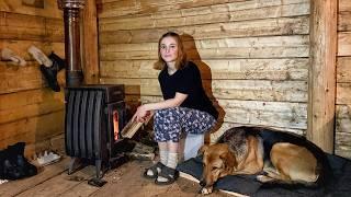 Cozy night in a big cabin in a wild snow-covered forest