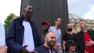 World's tallest people stroll the streets of Paris