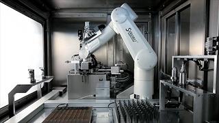 Grinding center with a Stäubli TX60L robot