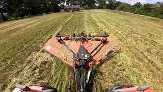 Mowing a hay field full of weeds, and sage.