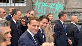 Giuseppe Conte and Emmanuel Macron walk through Naples historic centre | AFP