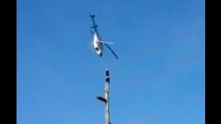 Crazy Helicopter stalled turned while crop dusting over power lines