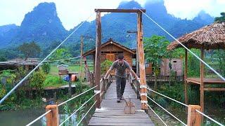 Completing the safety railing of the suspension bridge. Together Enjoy banh cuon on a rainy day