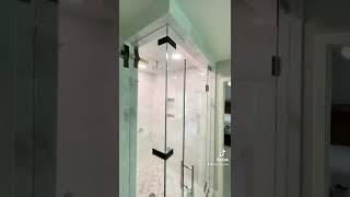 Amazing steam shower installed where the glass goes al the way to the ceiling!