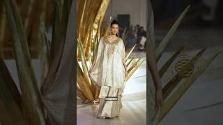 Step into a golden dream – a cascading cape set that shimmers with every move. Its effortless silho.