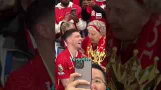 Give her your shirt Robbo!  94-year-old Liverpool fan Peggy got hands on the Premier League trophy!