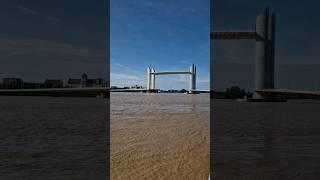 Sailing under fully raised Jacques Chaban Delmas bridge in Bordeaux 