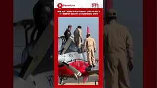 BJP MP Tejasvi Surya takes a ride on HAL's HTT trainer aircraft at AERO India show