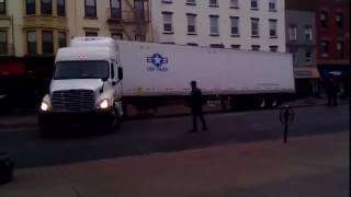 USA Truck Trying To U-Turn On A Narrow Street