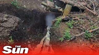 Ukrainian soldiers storm Russian trenches with rifles near Bakhmut