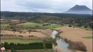 flying over Te Teko Whakatane orchard to clean hail net with spray