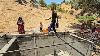 Village man skills.  Babak and Ali weld the roof of a village 