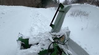 Running the snowblower at the club.. Blowing back snow banks.