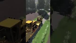 Truck Hauling a CAT Motor Grader through The Woods