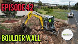  Building a boulder retaining wall with a Wacker Neuson EZ36 