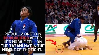 Priscilla Gneto is disqualified after her mobile fell on the tatami mat in the middle of the fight.