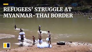 Myanmar villagers settle temporarily on border with Thailand