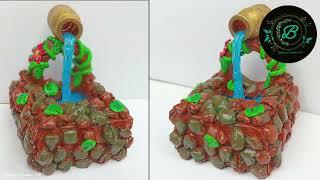 Beautiful showpiece making with waste materials |How to make waterfall from hot glue gun