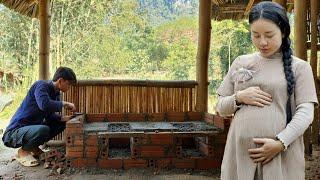 Young couple Repairing and constructing a smokeless stove 50% completed