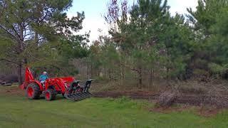 Kubota MX5800 with backhoe and CID grapple