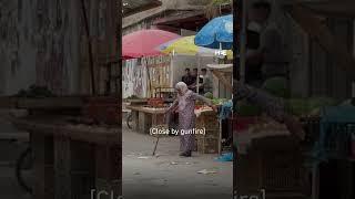 Elderly Palestinian woman braves gunfire from Israeli raid to cross the street