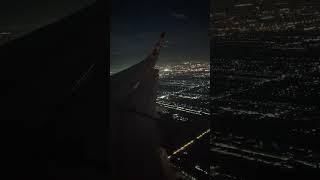 Beautiful view over Bangkok at night: approach and landing at Don Mueang Airport