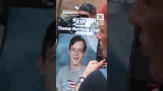 Person Holds Sign Outside RNC Calling Thomas Matthew Crooks A 'Hero'