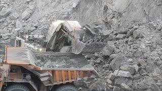 Loading Big Chunks of Rocks Liebherr R9350 Excavator Loading the Dump Truck With Big Copper Rocks