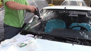 Polishing a scratched windshield.