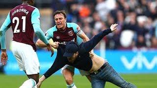 MARK NOBLE PUSHES A WEST HAM FAN TO THE GROUND