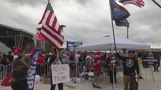 People await former president Trump's arrival outside Atrium Health Amphitheater in Macon