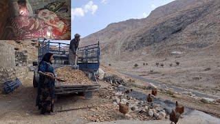 Iran nomadic life: preparing natural stones to finish the parking lot in the mountains