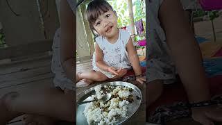 baby eating rice 