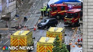 Driver detained after car drives into crowd at Liverpool parade