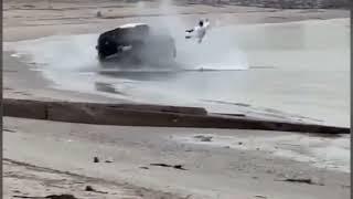 Incredible moment driver flies out of his vehicle after flipping it while driving on beach in Kuwait