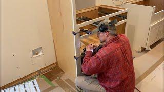 Episode 222: Kitchen cabinets: installing the refrigerator side panels and the first base cabinet!