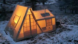 COZY TENT CAMP WITH STOVE IN A SNOWSTORM