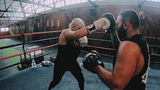 Monique Medved hitting pads with Stone Cold Steve Moxon