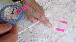 Taking a compass bearing on a O.S. 1:25000 map