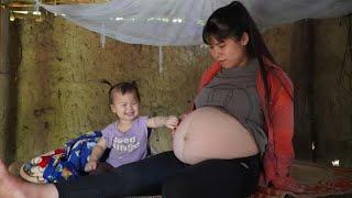 Pregnant single mother picks vegetables shrinkage to sell at the market/preparing to give birth.