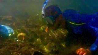 Found jar underwater in lake while scuba Diving with a metal detector