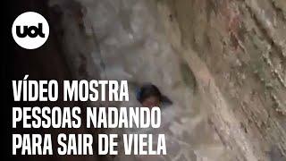 Chuvas no Recife: vídeo mostra pessoas nadando para sair de viela alagada