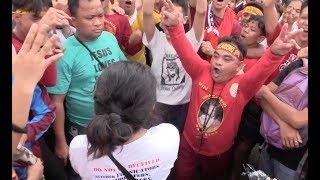 Group debates with Nazarene devotees during Traslacion